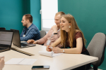 Colleagues working together in a conference room.