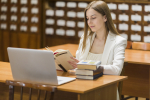 back-school-concept-with-woman-studying-library