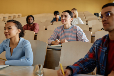 Group of school children sitting at lecture