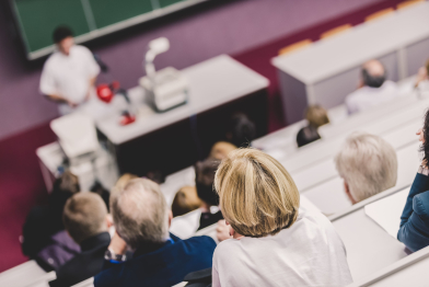 lecturer-university-healthcare-expert-giving-talk-medical-faculty-professors-participants-listening-lecture-making-notes