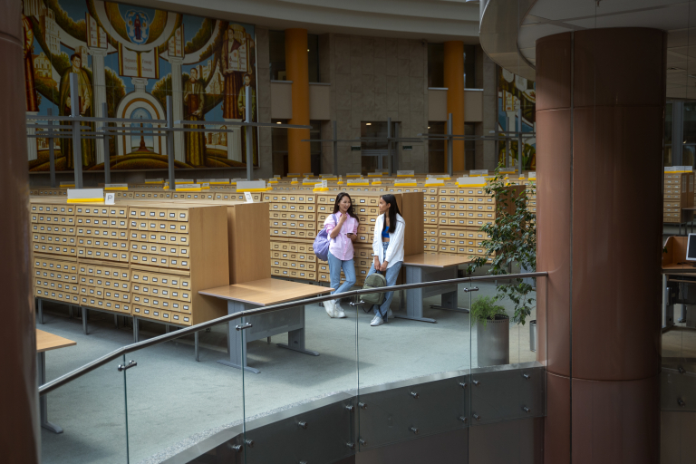 long-shot-smiley-students-chatting