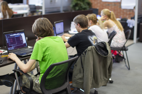 Programmers at work. Young guys work at computers