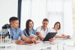 sitting-by-table-group-young-doctors-is-working-together-modern-office