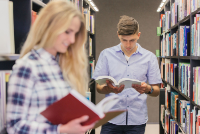 students-reading-books-bookshelves