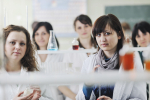 young-woman-students-group-bright-chemistry-lab