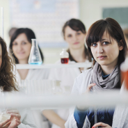 young-woman-students-group-bright-chemistry-lab